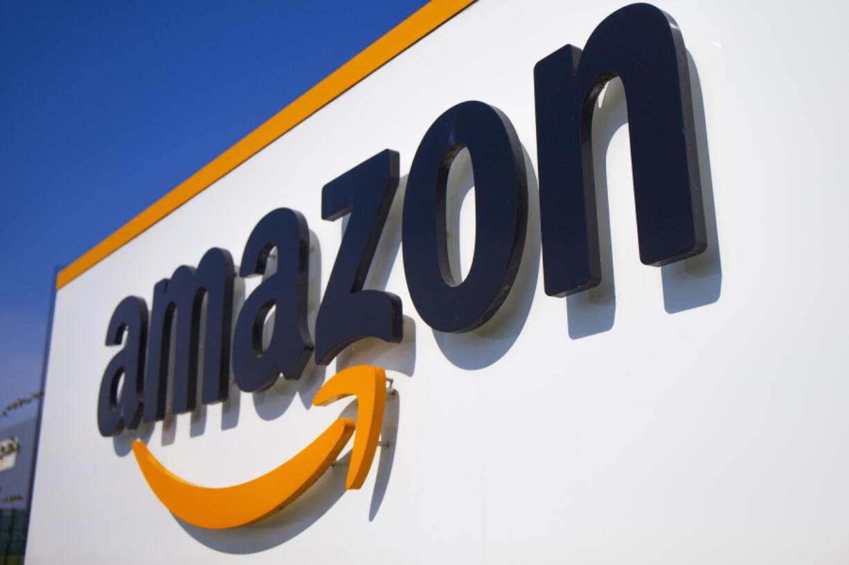 FILE - This April 16, 2020 shows the Amazon logo in Douai, northern France. A federal labor board is seeking the reinstatement of an Amazon employee who was fired after leading a protest in the early days of the pandemic calling for the company to do more to protect workers against COVID-19.