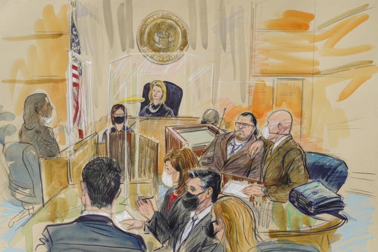 This artist sketch depicts Judge Dabney Friedrich looking out from the bench during jury selection for Guy Wesley Reffitt, joined by his lawyer William Welch, top right, in Federal Court, in Washington, Monday, Feb. 28, 2022. Seated from front left are members of the U.S. prosecution legal team, Tim Ryan, Risa Berkower, Jeff Nestler, and Amanda Rohde. Reffitt, a Texas man charged with storming the U.S. Capitol with a holstered handgun on his waist, is the first Jan. 6 defendant to go on trial.