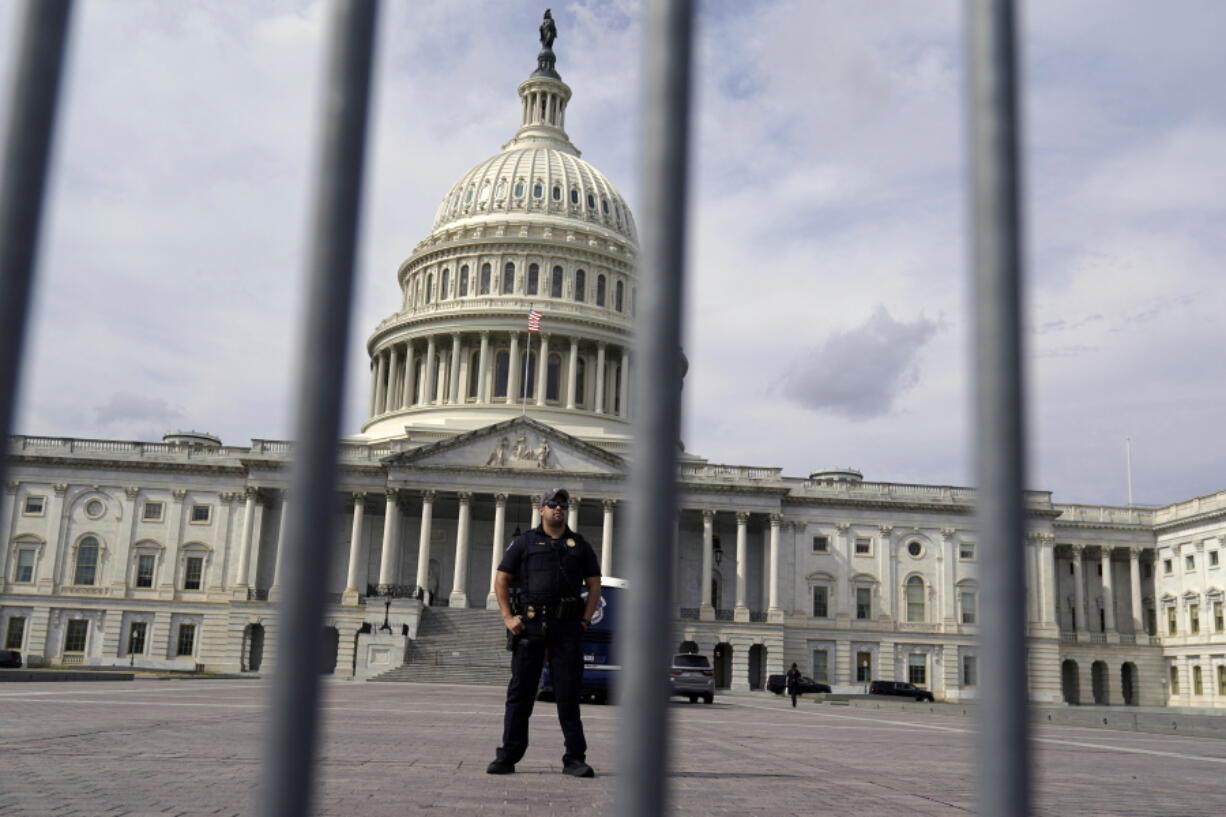 A U.S. Capitol Police officer stands guard in front of the Capitol Hill, Monday, March 7, 2022 in Washington.