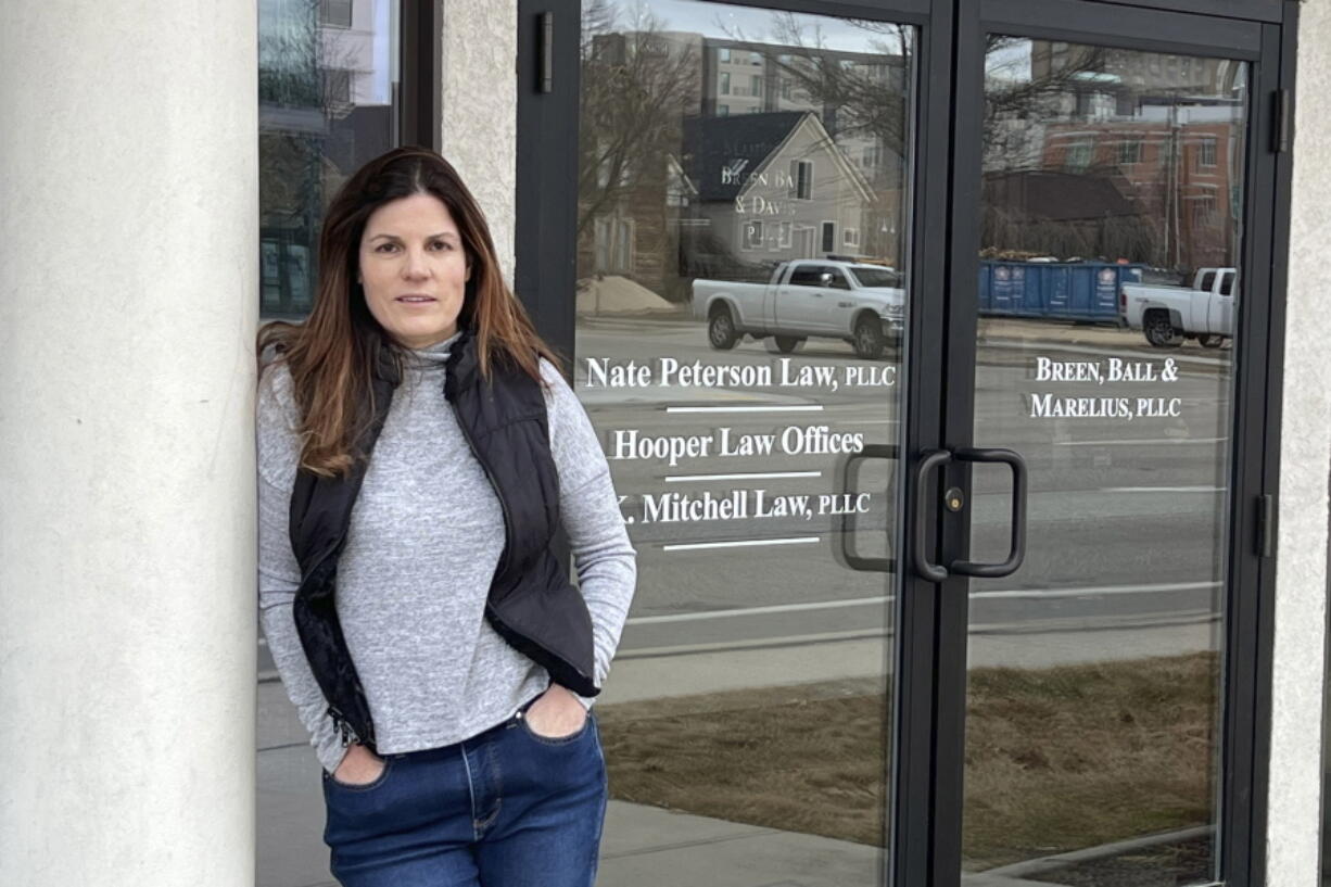 Erin Carver stands outside her attorney's office in Boise, Idaho, Monday, Feb. 28, 2022. Carver is asking the Idaho Supreme Court to declare that her ex-husband lacked the legal authority to allow their 16-year-old daughter to marry. Carver says the marriage was a sham designed to make her ongoing custody battle moot.