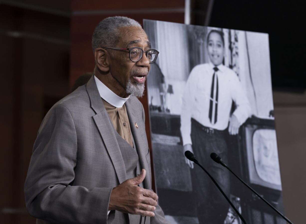 FILE - Rep. Bobby Rush, D-Ill., speaks during a news conference about the "Emmett Till Anti-Lynching Act" on Capitol Hill in Washington, on Feb. 26, 2020. Emmett Till, pictured at right, was a 14-year-old African-American who was lynched in Mississippi in 1955, after being accused of offending a white woman in her family's grocery store. Congress has given final approval to legislation that for the first time would make lynching a federal hate crime in the U.S. (AP Photo/J.