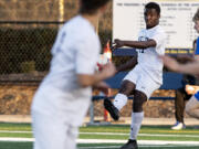 Seton Catholic’s David Moore threads the needle through the La Center defense with a long pass to a teammate on Tuesday, April 13, 2021, at Seton Catholic Preparatory School. The Cougars won 3-1 in the 1A Trico League game.