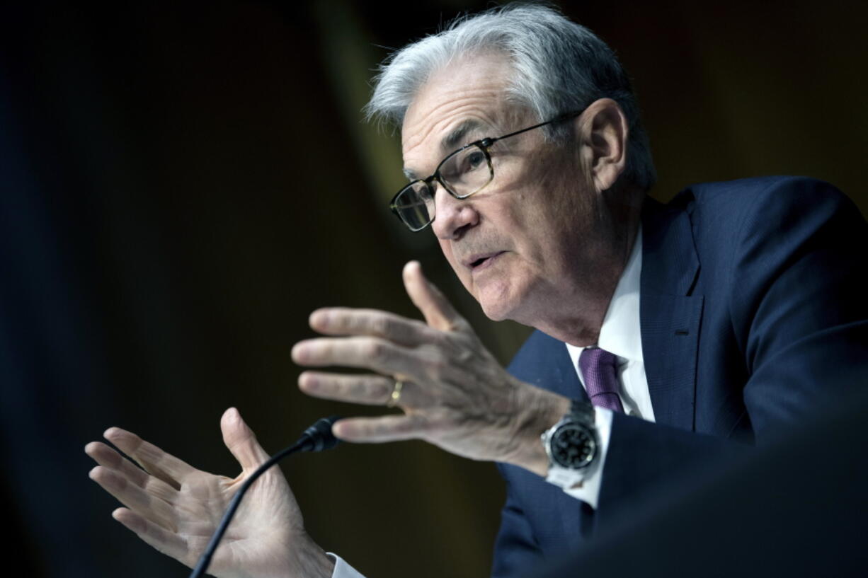 FILE - Federal Reserve Board Chairman Jerome Powell speaks during his re-nominations hearing before the Senate Banking, Housing and Urban Affairs Committee, Tuesday, Jan. 11, 2022, on Capitol Hill in Washington. The Federal Reserve will lift its benchmark short-term interest rate at its next meeting in two weeks, Powell says in prepared testimony he will deliver to a congressional committee Wednesday, March 2.