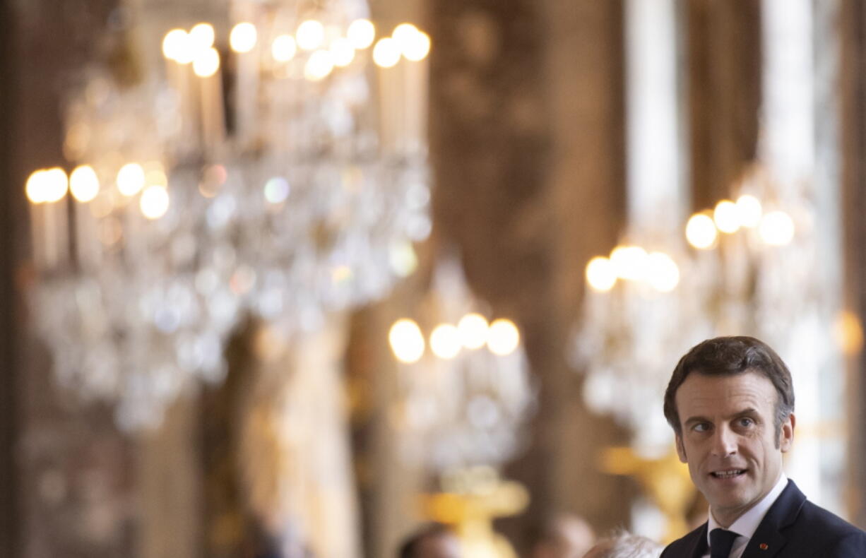 FILE - French President Emmanuel Macron attends an informal summit of EU leaders at the Chateau de Versailles in Versailles, west of Paris, Friday March 11, 2022. Macron went under criticism from other candidates for refusing to take part in any televised debate before the first round scheduled on April 10. Even though he formally announced he is running for a second term on March 3, Macron did not hold any rally yet.