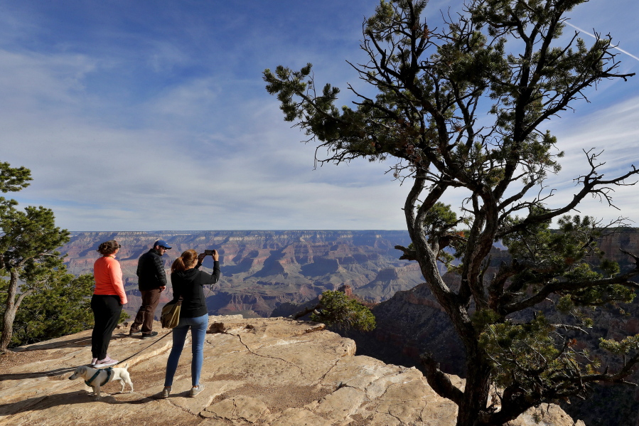 FILE - This file photo shows visitors at the Grand Canyon in Grand Canyon, Arizona, on May 15, 2020. Joseph Don Mount of Chehalis, Wash., pleaded guilty to a misdemeanor on Friday, March 25, 2022, for his acknowledged role in organizing a rim-to-rim hike at Grand Canyon for nearly 140 people when the size of such groups was limited. He was sentenced to two years of probation.