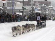 Five-time winner Dallas Seavey takes his sled dog team through a snowstorm in downtown Anchorage, Alaska, on Saturday, March 5, 2022, during the ceremonial start of the Iditarod Trail Sled Dog Race. The competitive start of the nearly 1,000-mile race will be held March 6, 2022, in Willow, Alaska, with the winner expected in the Bering Sea coastal town of Nome about nine days later.