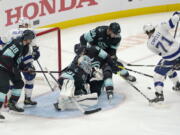 Tampa Bay Lightning center Anthony Cirelli (71) takes aim on a goal against the Seattle Kraken during the third period of an NHL hockey game Wednesday, March 16, 2022, in Seattle. (AP Photo/Ted S.