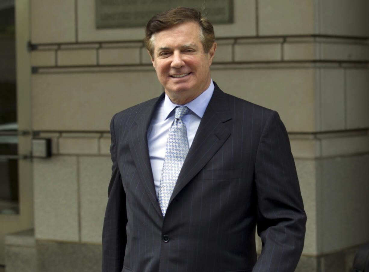 FILE - In this May 23, 2018, photo, Paul Manafort, President Donald Trump's former campaign chairman, leaves the Federal District Court after a hearing in Washington.  Manafort was removed from a plane at Miami International Airport before it took off for Dubai because he carried a revoked passport. Miami-Dade police confirmed Wednesday, March 23, 2022,  that Manafort was removed from the Emirates Airline flight without incident on Sunday night.