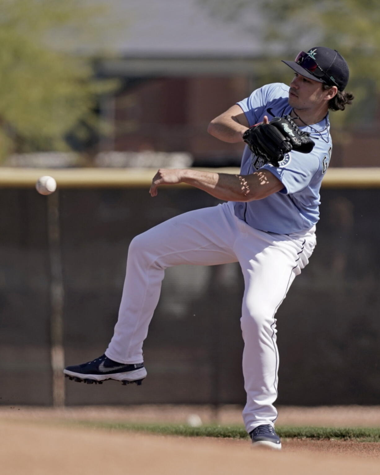 Seattle Mariners pitcher Marco Gonzales throws a ball during spring training baseball practice Wednesday, March 16, 2022, in Peoria, Ariz.