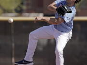 Seattle Mariners pitcher Marco Gonzales throws a ball during spring training baseball practice Wednesday, March 16, 2022, in Peoria, Ariz.