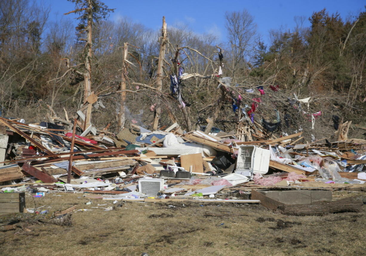 Cleanup efforts are underway in Winterset, Iowa, on Sunday, March 6, 2022, after a tornado tore through an area southwest of town on Saturday.