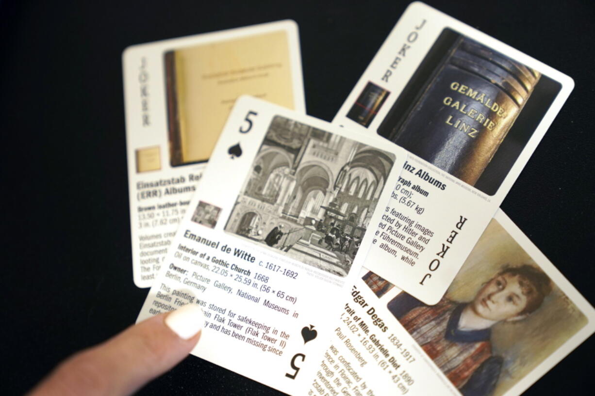 Anna Bottinelli holds playing cards at the organization's office in Dallas.