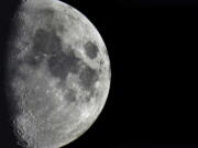 FILE - Impact craters cover the surface of the moon, seen from Berlin, Germany, Tuesday, Jan. 11, 2022. The moon is about to get walloped by 3 tons of space junk, a punch that will carve out a crater that could fit several semitractor-trailers. A leftover rocket is expected to smash into the far side of the moon at 5,800 mph (9,300 kph) on Friday, March 4, 2022, away from telescopes' prying eyes. It may take weeks, even months, to confirm the impact through satellite images.