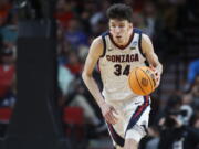 Gonzaga center Chet Holmgren (34) moves the ball against Georgia State during the second half of a first round NCAA college basketball tournament game, Thursday, March 17, 2022, in Portland, Ore.