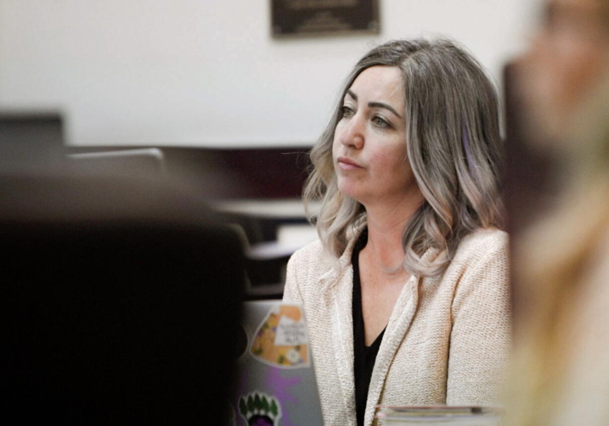 RaDonda Vaught, a former Vanderbilt University Medical Center nurse charged with in the death of a patient, listens to the opening statements during her trial at Justice A.A. Birch Building in Nashville, Tenn., Tuesday, March 22, 2022. Vaught was charged with reckless homicide for accidentally administering the paralyzing drug vecuronium to 75-year-old Charlene Murphey instead of the sedative Versed in December on Dec. 26, 2017. Vaught admitted the error as soon as she realized it, and the state medical board initially took no action against her. Prosecutors say Vaught made multiple errors that day and "recklessly ignored" her training.