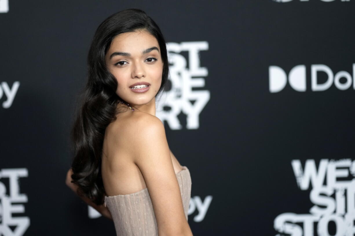 FILE - Rachel Zegler attends the "West Side Story" premiere in New York on Nov. 29, 2021. The film is nominated for seven Academy Awards, including best picture, director and supporting actress for Ariana DeBose. Yet Zegler, the star of the movie musical, will not be attending the ceremony on Sunday. Zegler, the 20-year-old who plays Maria, posted Sunday that she tried to go but "it doesn't seem to be happening" and that she be rooting for "West Side Story" from her couch.