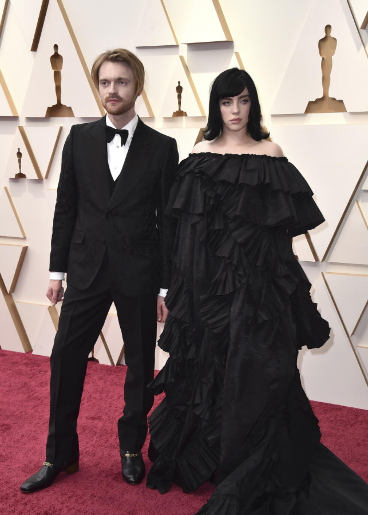 Finneas, left, and Billie Eilish arrive at the Oscars on March 27, 2022, at the Dolby Theatre in Los Angeles. Ukrainian President Volodymyr Zelenskyy's call for humanitarian help has been answered by the European Commission, the government of Canada and dozens of celebrities assembled by advocacy nonprofit Global Citizen, including Oscar winners Billie Eilish and Finneas.