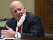 FILE - U.S. Postal Service Postmaster General Louis DeJoy speaks during a hearing on Capitol Hill, on Feb. 24, 2021, in Washington. DeJoy said Thursday, March 31, 2022, that the Justice Department has closed without criminal charges an investigation into political fundraising activity at his former business.