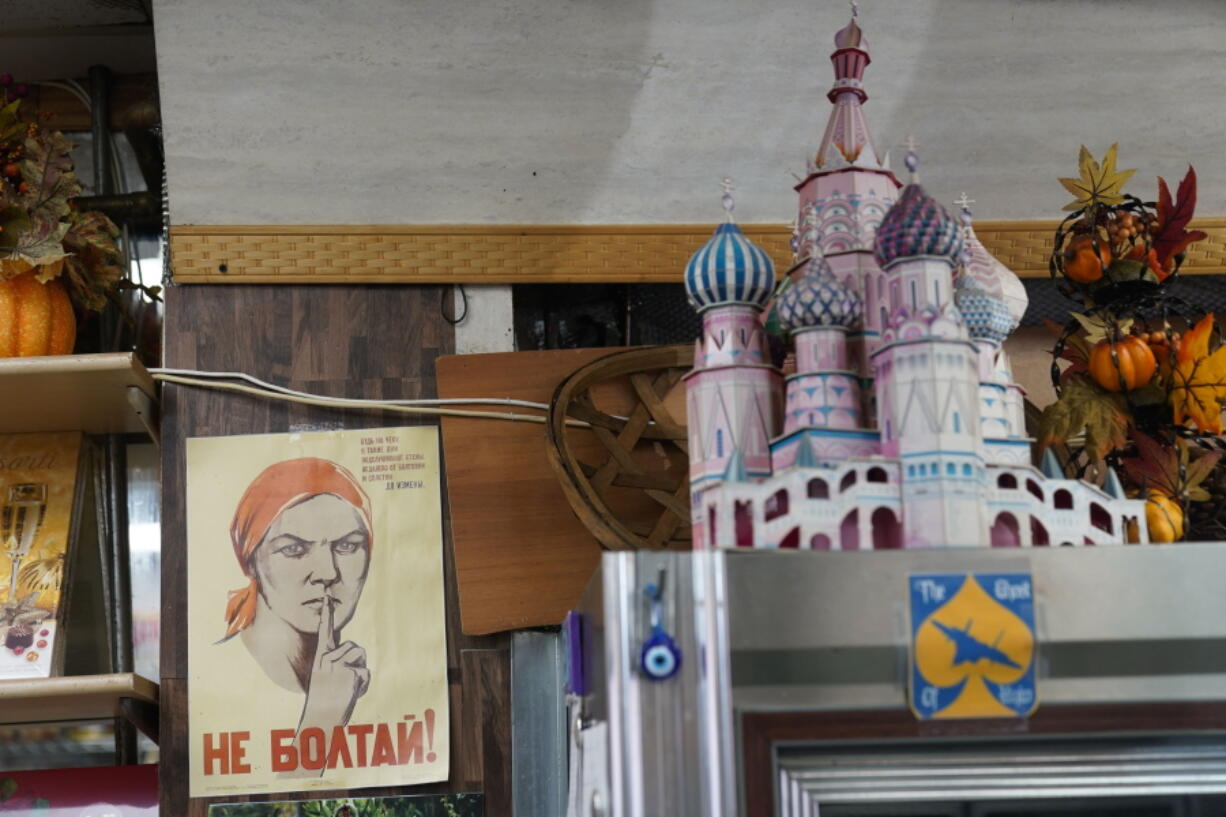 Signs from from Russia, Ukraine, and other countries are displayed at Moscow on the Hudson in New York, Wednesday, March 16, 2022. Angered by the deadly violence and the humanitarian crisis resulting from Russia's war on Ukraine, some Americans are dumping their frustrations on Russian businesses and brands -- or anything that sounds Russian. Business owners and experts say it's the most intense anti-Russian sentiment they've seen, but they call the behavior irrational and misplaced, especially when so many owners are denouncing Russian President Vladimir Putin's invasion, not to mention the fact that some of them are not even Russian.