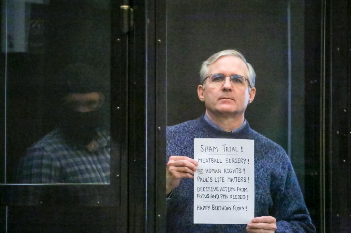 FILE - Paul Whelan, a former U.S. Marine who was arrested for alleged spying, listens to the verdict in a courtroom at the Moscow City Court in Moscow, Russia, June 15, 2020.