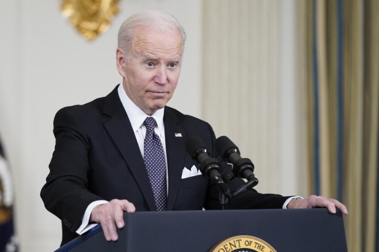 President Joe Biden listens to a question from a reporter about Russian President Vladimir Putin after speaking about his proposed budget for fiscal year 2023 in the State Dining Room of the White House, Monday, March 28, 2022, in Washington.