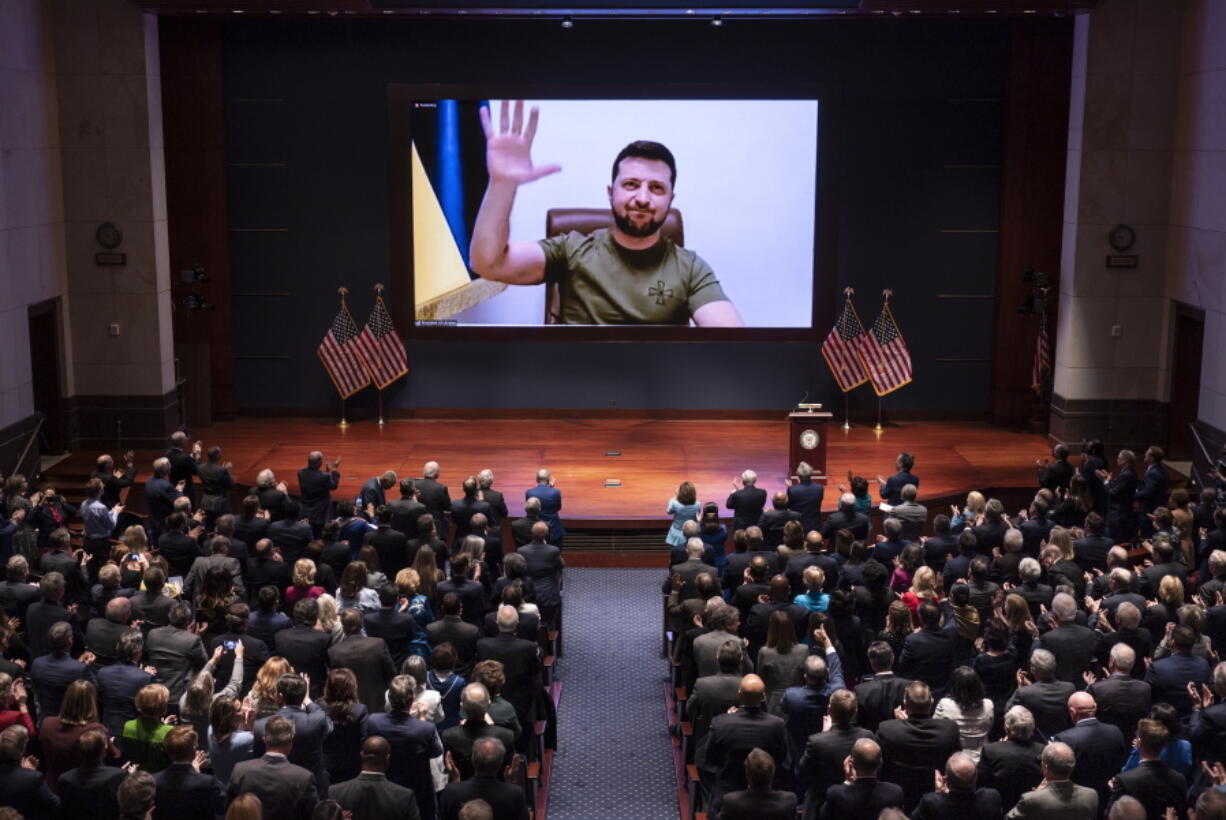 Ukrainian President Volodymyr Zelenskyy speaks to the U.S. Congress by video to plead for support as his country is besieged by Russian forces, at the Capitol in Washington, Wednesday, March 16, 2022. (AP Photo/J.