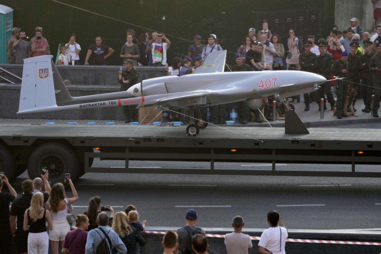 FILE - A Turkish-made Bayraktar TB2 drone is displayed during a rehearsal of a military parade dedicated to Independence Day in Kyiv, Ukraine, Aug. 20, 2021. The drones, which carry lightweight, laser-guided bombs, have carried out unexpectedly successful attacks in the early stages of Ukraine's conflict with Russia.