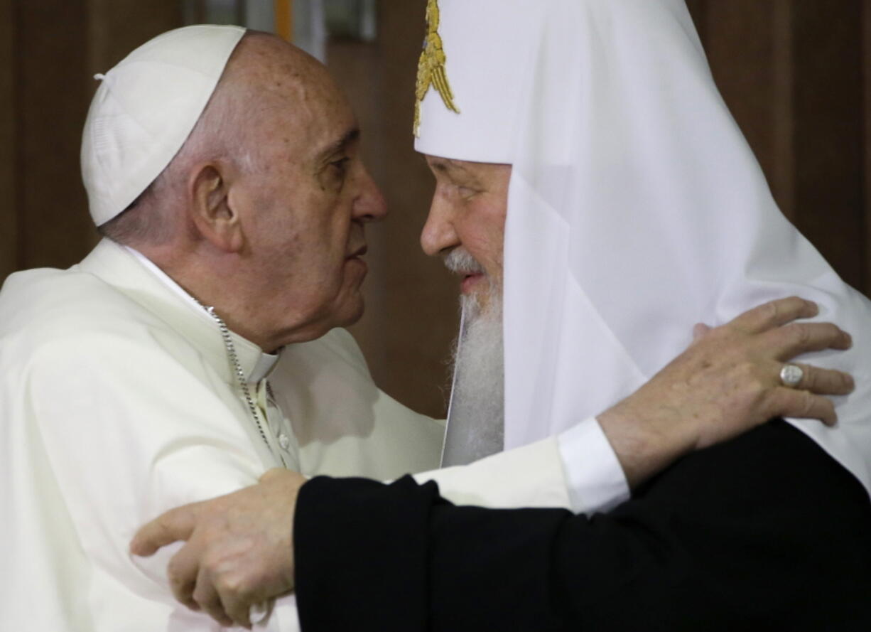 FILE - Pope Francis, left, embraces Russian Orthodox Patriarch Kirill after signing a joint declaration on religious unity in Havana, Cuba on Feb. 12, 2016. The head of the Polish bishops' conference had done what Pope Francis has so far avoided doing by publicly condemning Russia's invasion of Ukraine. Archbishop Stanislaw Gadecki also publicly urged the head of the Russian Orthodox Church to use his influence on Vladimir Putin to demand an end to the war and for Russian soldiers to stand down. "The time will come to settle these crimes, including before the international courts," Gadecki warned in his March 2 letter to Patriarch Kirill.