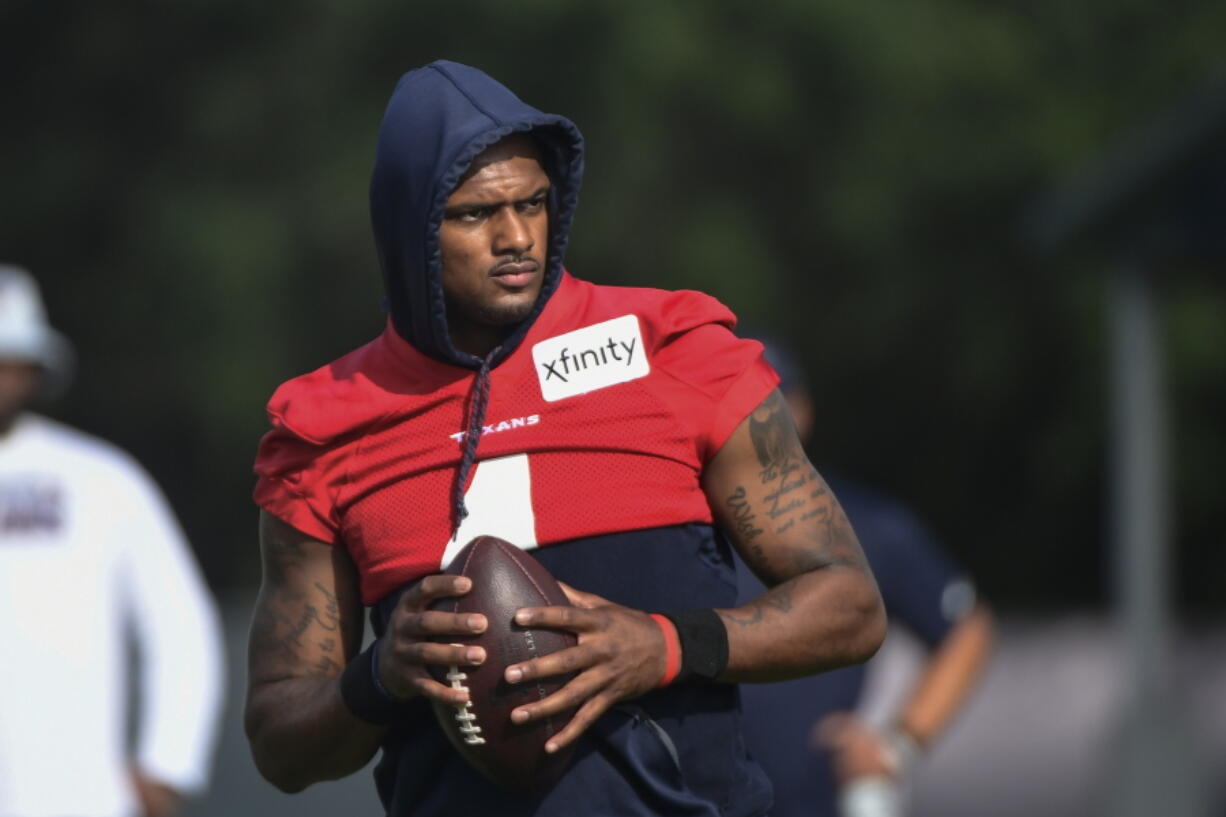 FILE - Texans quarterback Deshaun Watson (4) practices with the team during NFL football practice Monday, Aug. 2, 2021, in Houston. A judge has declined efforts by attorneys for Houston Texans quarterback Deshaun Watson to delay all his depositions in connection with lawsuits filed by 22 women who have accused him of sexual assault and harassment. During a court hearing Monday, Feb. 21, 2022, defense attorney Rusty Hardin asked that depositions be delayed until the end of a criminal investigation.