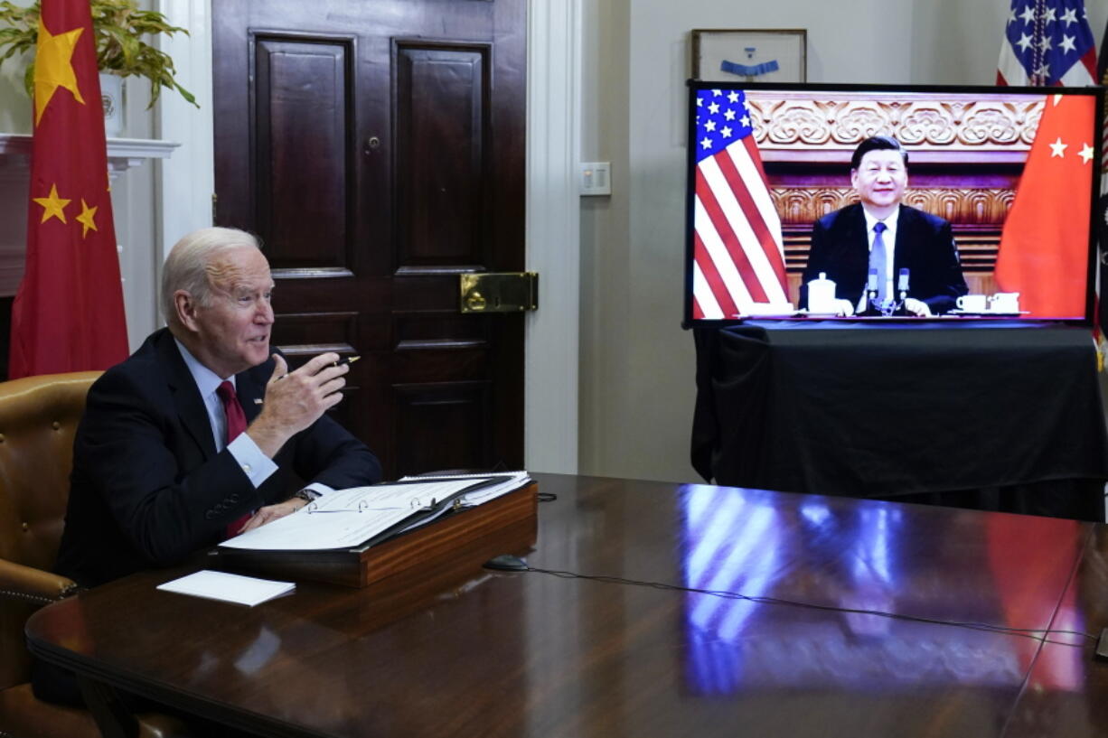 FILE - President Joe Biden meets virtually with Chinese President Xi Jinping from the Roosevelt Room of the White House in Washington, on Nov. 15, 2021.