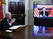 FILE - President Joe Biden meets virtually with Chinese President Xi Jinping from the Roosevelt Room of the White House in Washington, on Nov. 15, 2021.