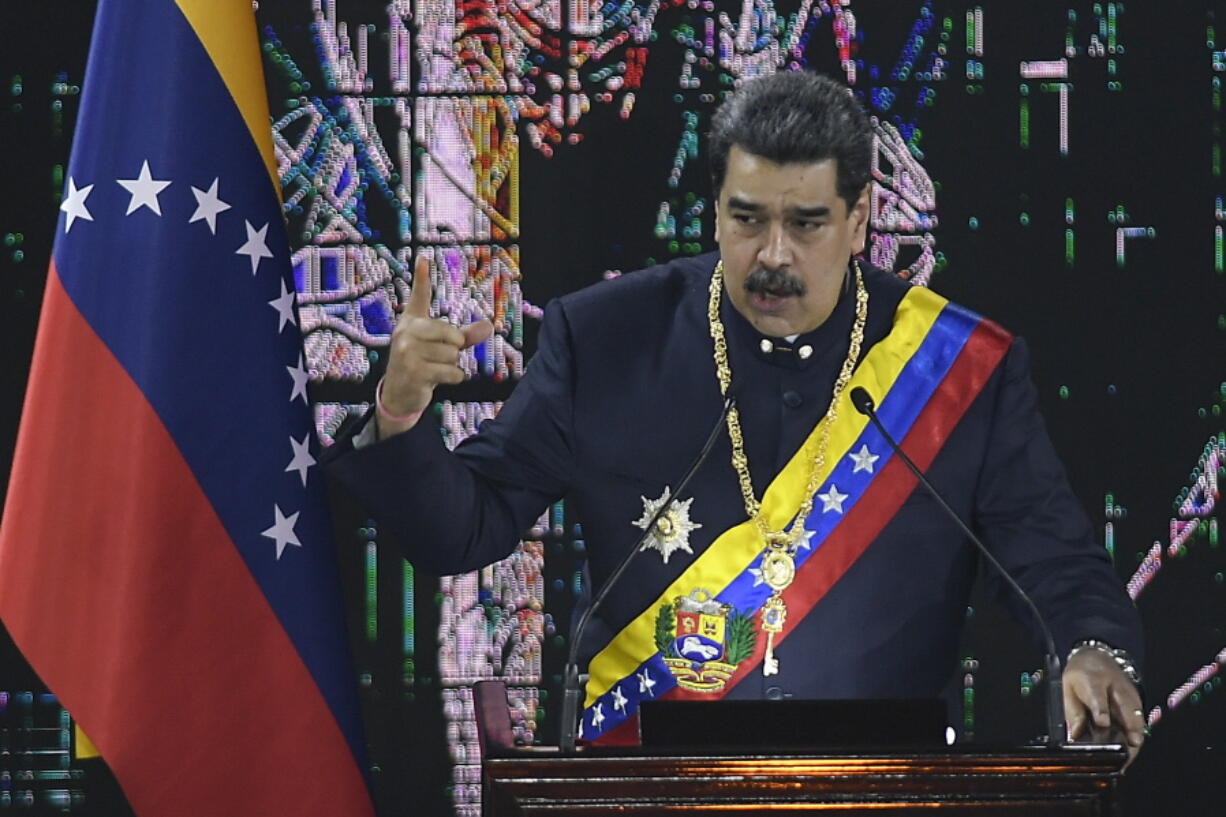 FILE - Venezuelan President Nicolas Maduro speaks during a ceremony marking the start of the judicial year at the Supreme Court in Caracas, Venezuela, Jan. 27, 2022. Maduro signaled an interest in improving relations with the U.S. following talks with high-level American officials prompted in part by Russia's invasion of Ukraine and concerns of rising gas prices in the U.S., in a televised meeting with cabinet members late Monday, March 7, 2022, but did not provide details of the discussions.