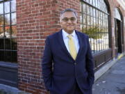 FILE - Dr. Ashish Jha, dean of Brown University's School of Public Health, poses for a photo Dec. 23, 2020, in Newton, Mass. President Joe Biden's COVID-19 coordinator Jeff Zients and his deputy Natalie Quillian are leaving the administration next month, the White House announced Thursday, March 17, 2022. They will be replaced by Dr. Ashish Jha.