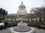 The sun dial near the Legislative Building is shown under cloudy skies, Thursda at the Capitol in Olympia. (Ted S.