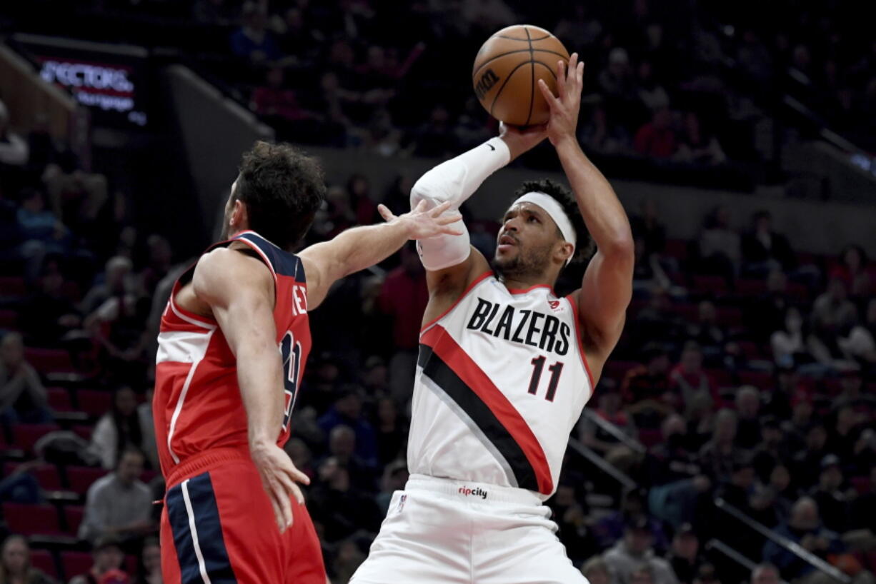 Blazers guard Josh Hart shoots over the Wizards' Raul Neto during the Portland's win. Hart finished with a career-high 44 points as the Blazers ended a six-game losing streak.