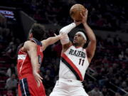 Blazers guard Josh Hart shoots over the Wizards' Raul Neto during the Portland's win. Hart finished with a career-high 44 points as the Blazers ended a six-game losing streak.