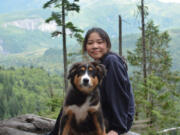 International student Cherry Winarto goes on a hike with her dog, Milo, at Lake Serene. She likes hiking in her leisure time with her sisters and friends to keep her spirits up throughout these challenging times.