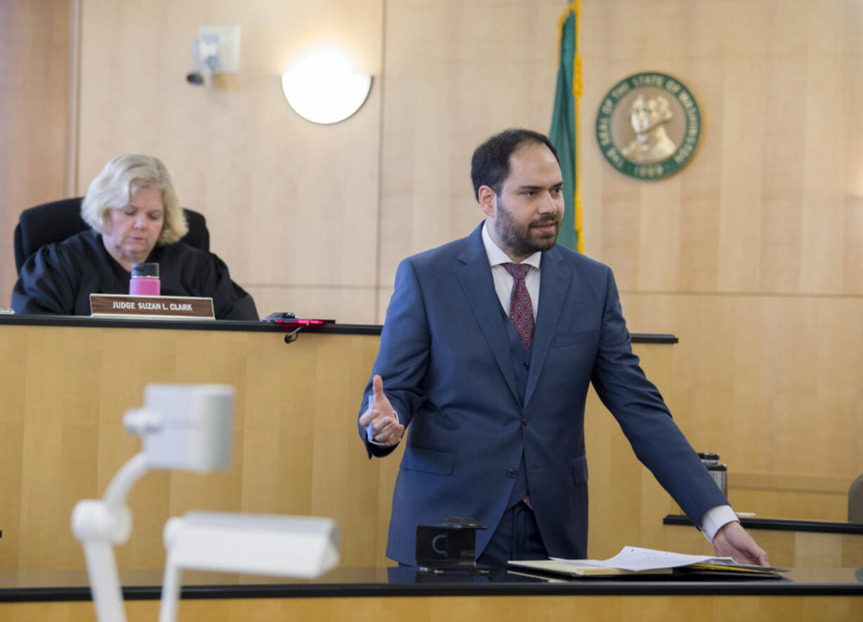 Defense attorney Sean Downs, foreground, speaks to the jury as Judge Suzan Clark listens in Clark County Superior Court on April 6, 2017.