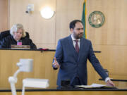 Defense attorney Sean Downs, foreground, speaks to the jury as Judge Suzan Clark listens in Clark County Superior Court on April 6, 2017.