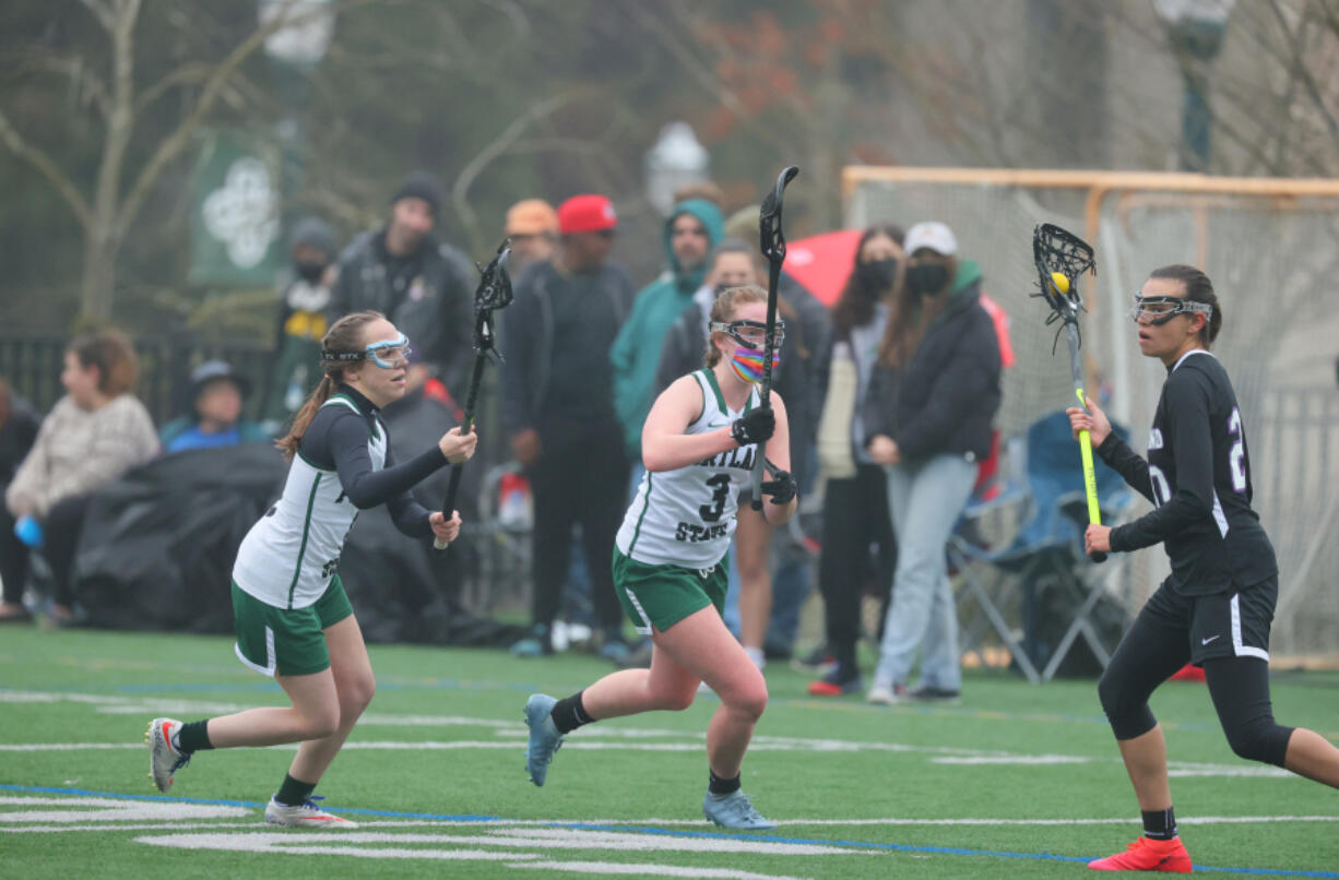 Vancouver native Mikhenna Miller, right, seen playing for the University of Portland women's lacrosse team against Portland State, is in her final season with the Pilots before she commissions as a second lieutenant in the Washington National Guard and begins flight school as a helicopter pilot.