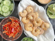 Cornstarch-dusted fried shrimp is the star of these easy-to-compose lettuce wraps with pickled veggies.