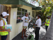 Charles Burdo (center), speaks with Rajeev Vaidyanathan, Ph.D, Director of U.S. Operations Oxitec, about the genetically engineered Aedes aegypti mosquitoes being released on June 9, 2021, Marathon, Florida.