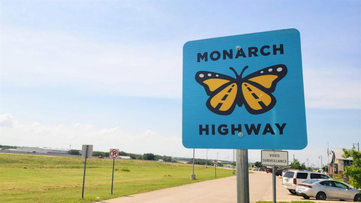 A road sign marks the Monarch Highway corridor near Abbott, Texas. Energy and transportation companies as well as some state and local governments across 23 states have voluntarily agreed to increase monarch habitat conservation.