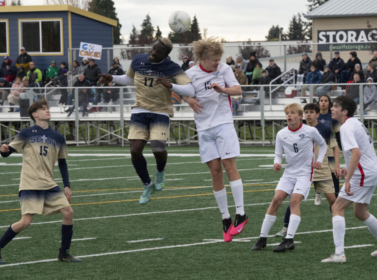 Seton Catholic's David Moore (17) and King's Way Christian's Cade Erwin (15) challenge for the ball during Seton Catholic's 3-0 win Tuesday.