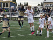 Seton Catholic's David Moore (17) and King's Way Christian's Cade Erwin (15) challenge for the ball during Seton Catholic's 3-0 win Tuesday.