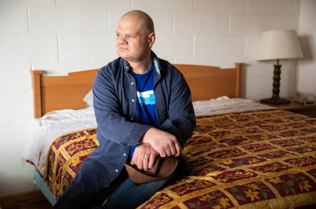 Jason Young inside his hotel room at San Juan Motel in Anacortes on Friday, March 25, 2022. Young was accused of stealing bicycles from the Port of Friday Harbor in 2019, based largely on what a deputy said he saw in a security video. Two years later, the deputy said his original statement about what he saw in the video was inaccurate. Young said while the case dragged on, his business working on cars dried up because no one on San Juan Island wanted to hire an accused thief. He and his partner are now homeless.