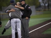 Battle Ground coach Billy Hayes embraces Skyview coach Seth Johnson prior to their teams? 4A Greater St. Helens League baseball game at Propstra Stadium on Monday, April 25, 2022.