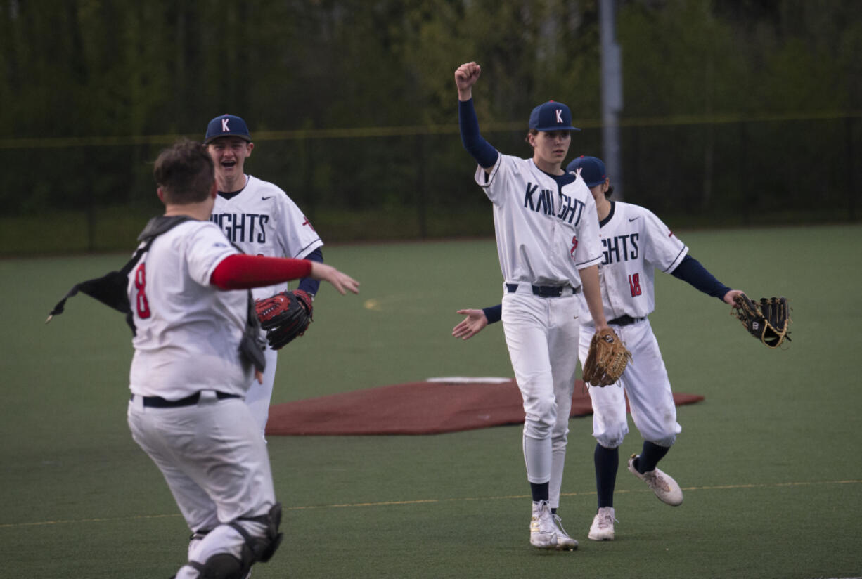 King?s Way Christian's Makani Geisen raises a fist in victory as his teammates (from left) Andrew Peru, Carson Gilligan and Derek Tarnoski celebrate a win.