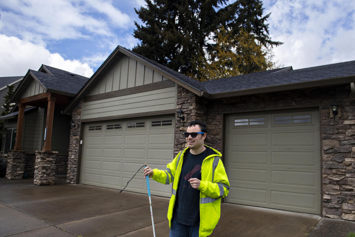 Bob Cavanaugh, shown at his northwest Vancouver home Wednesday, is visually impaired. He has been active with the Northwest Association for Blind Athletes, a Vancouver-based nonprofit, since he moved to the area from Edmonds two years ago. Through the organization, Cavanaugh has participated in everything from paddleboarding events to skiing on Mount Hood.