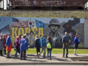 "The Remembrance Wall," or War Memorial, has been painted by many artists over the years. These pieces on Phil Arnold Way, on the north side of the railway berm in downtown Vancouver, pay tribute to George Marshall and the Korean War. They were sponsored by the Korean War Veterans Association, the Veterans of Foreign Wars and several individuals.